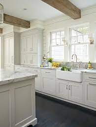 Light Gray And White Kitchen With A Classic Design Features Stacked Light Gray Shaker Cabinet Rustic Kitchen Cabinets White Kitchen Design Kitchen Inspirations