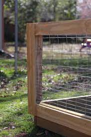Slowly, place the hardware cloth into the trench and around the fence. How To Build A Diy Raised Bed Garden Fence The Kitchen Garten