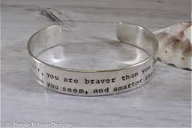 This grandiosity of the scale on which he operates coupled with humility and kindness. Pooh Quote Bracelet Remember You Are Braver Than You Believe Stronge Purple Pelican Designs