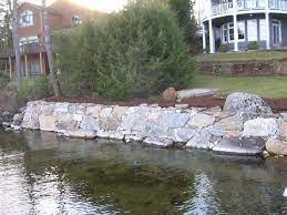 Retaining wall on a lake. Large Boulder Wall Option Lake Landscaping Lake Cottage Backyard Landscaping