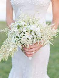 Bride S Whimsical And Romantic Bouquet Made With Lily Of The Valley Stephanotis Sweet Williams And Small Wedding Bouquets Wedding Bouquets Evergreen Wedding