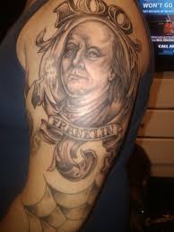 To honor his important contributions to history. Black Ink Homemade Shoulder Tattoo Of Benjamin Franklin Portrait With Lettering Tattooimages Biz