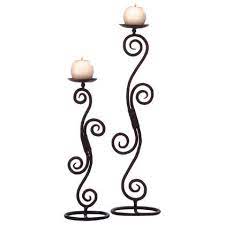 Easily and dramatically improve your table setting with this wrought iron candle holder stand and included glass vase. I Love Wrought Iron Metal Work For Candle Holders Mirrors Plant Stands Bed Frames Gates Iron Candle Wrought Iron Candle Holders Iron Candle Holders