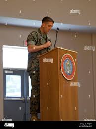 U.S. Marine Corps Gunnery Sgt. Derek Strasser with Marine Corps Combat  Service Support Schools narrates during the Instructor of the Year Award  Ceremony held aboard Camp Johnson, N.C., March 31, 2016. One