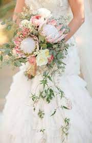 A Big Floral Trend Cascading Bouquets Onefabday Com Unique Bridal Bouquets Protea Bouquet Wedding Bridal Bouquet