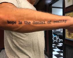 As if it isn't enough to look like someone has slapped a pack of margarine over his head, he has to cover himself in doodles as well. 75 Quote Tattoos That Will Inspire Everyone Wild Tattoo Art