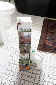 To clean shower grout with white vinegar, mix one part vinegar to two parts water and scrub with a stiff brush. The Best Tile Floor Cleaner We Ve Used For Our White Bathroom Tiles Love Create Celebrate
