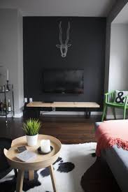 Black Accent Wall In Small Living Room How To Decorate Around A Tv Hide It By Painting The Wall Behind It A Dark Color Come See Other Ideas And Bedroom Tv Wall Dark Living Rooms Black Accent Walls