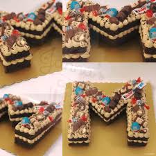 You can use small plain round biscuits and write letters on them, if you prefer. Janna S Cake Letter M Kinder Birthday Cake Facebook