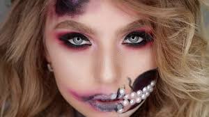 Woman Poses for the Camera in the Studio. Makeup for Halloween Stock Video 