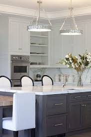 Suzie Milton Development Chic Two Tone Kitchen Design With Mirrored Tiles Pendants Over Kitchen Design Contemporary Kitchen Walnut Kitchen