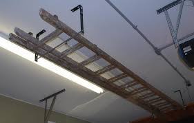 Pin By Marianne Zimmerman On Miscellaneous Ladder Storage Garage Workshop Layout Ladder