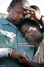 Barbara Pritchett, right, is comforted by her cousin Donny Joubert,... News  Photo