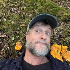 Corynaea crassa is a parasitic plant that lacks chlorophyll and leaves and  sends up "little pink knobs" which are technically a structure full of tiny  flowers (in this case a spadix). It