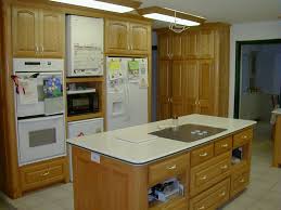 Oak cabinets work best with the right custom countertop as the traditional colour of oak matches a lot of modern designs. Kitchen Cabinets Fiorenza Custom Woodworking