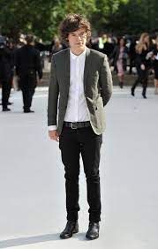 They are black chelsea boots. From Teenage Trainers To Gucci Mary Janes Track Harry Styles S Remarkable Footwear Evolution British Vogue