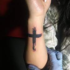 Raised by a hand towards the heavens is a wooden cross tattoo design, as if emitting rays of light amidst white clouds as a backdrop. Download 33 Cross Tattoo Meaning On Hand Islamic Pattern Vector Png