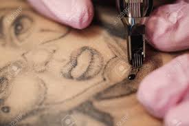 Looking for tattoo cartridge needles yuelong 100pcs new generation? Close Up Of A Tattoo Needle The Process Of The Tattoo Master Pink Womens Protective Gloves Tattoo Sketch Nun Stock Photo Picture And Royalty Free Image Image 127588628