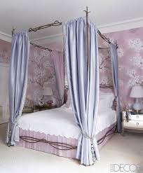 The bed is adorned with pink skirts and curtains with frilling and bows. 25 Canopy Bed Ideas Modern Canopy Beds And Frames