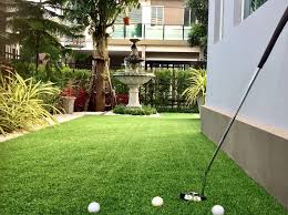 Level out the area with a rake to remove any rocks or pebbles. How To Make A Putting Green In Your Garden With Fake Turf