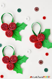 Download Homemade Milk Cap Holly Ornaments Christmas Kids Craft PSD Mockup Templates
