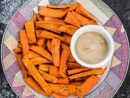 Want to make healthy sweet potato fries at home? Sweet Potato Fries With Maple Tahini Garlic Dip Vegan One Green Planet
