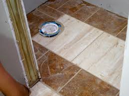 Installing baseboards requires measuring, cutting, placing and fastening the baseboards to the wall. Wainscoting And Tiling A Half Bath Hgtv