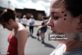 Derrick Slaughter attends a march through the streets of Norwalk... News  Photo