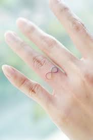 2 pros and cons about ring tattoos. Finger Tattoos Simple Yet Unique Designs At Your Fingertips Glaminati
