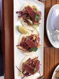 Marinate the fish with lime juice, garlic, cumin, chili powder, and then top with tangy cabbage slaw. Tuna Tacos Picture Of The Keg Steakhouse Bar Esplanade Toronto Tripadvisor