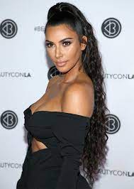 Trend Alert Celebs Can T Stop Wearing The Half Up Half Down Hairstyle Half Ponytail Kim Kardashian Hair Long Hair Styles