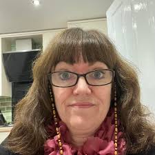 Stuck in traffic driving home in the rain. Lovely rainbow started, became a  double, well framed against the dark clouds. Started to thin as I got to my  estate. Parked the car