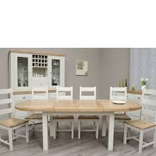 A swedish gustavian style painted wood extension dining room table from the 19th century, with carved diamond motifs, brass accents and three new leaves. Deluxe Painted Oval Extending Dining Table Chairs Set