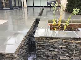 Grey Quartz Paddlestones Used For This Raised Level Patio Come Water Feature Garden Design By David G Private Garden Design Stone Pool Backyard Garden Design