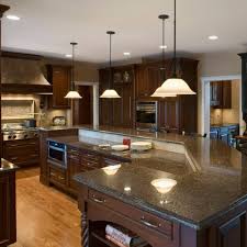 If you prefer dark upper and lower cabinetry, soften the sharp contrast between the dark cabinets and other areas by using light colors for your ceiling, countertops and walls. 5 Perfect Kitchen Countertop And Flooring Matches For Dark Cabinets