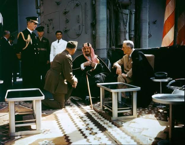 President Franklin Roosevelt meets with King Ibn Saud, of Saudi Arabia, on board USS Quincy (CA-71) in the Great Bitter Lake, Egypt, on 14 Feb. 1945. The King is speaking to the
