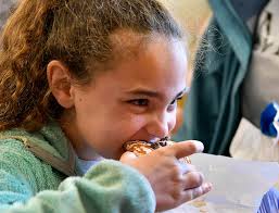 PHOTOS: Winning second graders get to try their donut creations