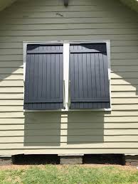 Board Batten Bahama Shutters Offer Window Shading Opening Protection And Privacy As Well As Add To The Aesth Bahama Shutters Shutters Exterior House Shutters