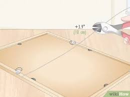 A quick and easy tutorial on how to hang a picture frame with a wire. How To Install Picture Frame Wire 9 Steps With Pictures