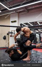 Two men wrestlers of grappling makes submission wrestling. Practice  fighting techniques Stock Photo by ©ufabizphoto 478799822