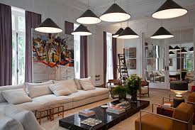Multicultural friends sitting on bed and painting nails on legs and hands. Living Room Paint 2019 9 Best Living Room Paints Ideas To Try Now