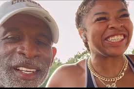 Shelomi trains with her dad Deion Sanders