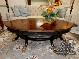 Oval Top Coffee Table In Burled Mahogany With Rubbed Black Base And Gold Claw Feet Looks Like A Million Bucks But It S Not At Coffee Table Table Dining Table