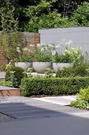 Containers In A Contemporary Style Garden Classic Garden Design Classic Garden Urban Garden