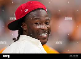 Tennessee running back Alvin Kamara (6) is tripped up by Bowling Green  defensive back Clint Stephens, bottom, as linebacker Austin Valdez (16) and  defensive back Eilar Hardy (4) pursue in the first