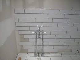 For a superior install, we used a riamondi rls tile leveling. Offset Subway Tiles White Subway Tiles Bathroom Tile Designs Tile Shower Niche
