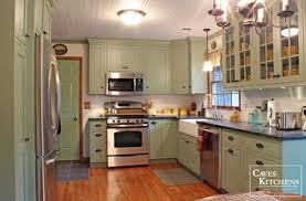 Sage Green Country Cottage Kitchen With Farmhouse Sink Transitional Kitchen Other Metro Green Country Kitchen Country Cottage Kitchen Trendy Kitchen Tile