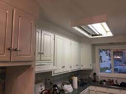 The first step in refinishing your kitchen cabinets is to remove all the hardware with a screwdriver or drill. Kitchen Cabinets Painting Kitchener On Staining Refinishing Refacing