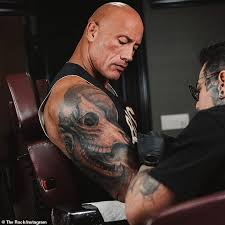 The fact he has multiple letters means that he has gone up against the worst in a gang vs one s. Dwayne Johnson Gives Update On His Massive Arm Tattoo Of A Bull That He Has Been Enhancing Daily Mail Online