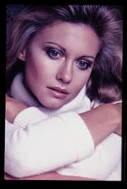 Olivia Newton-John. This picture, she looked so beautiful and gorgeous.  This is picture background for "Grease" (1978). 💖💖💖